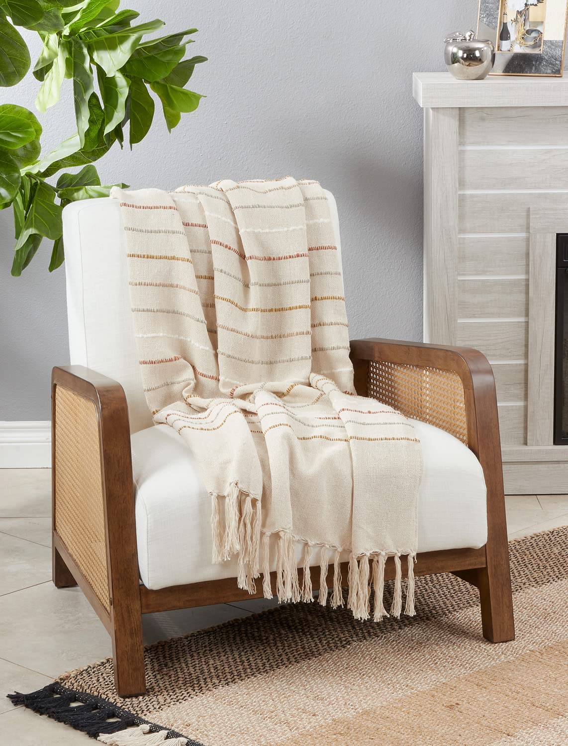 Ivory woven stripe throw blanket with knotted tassels. 50x60