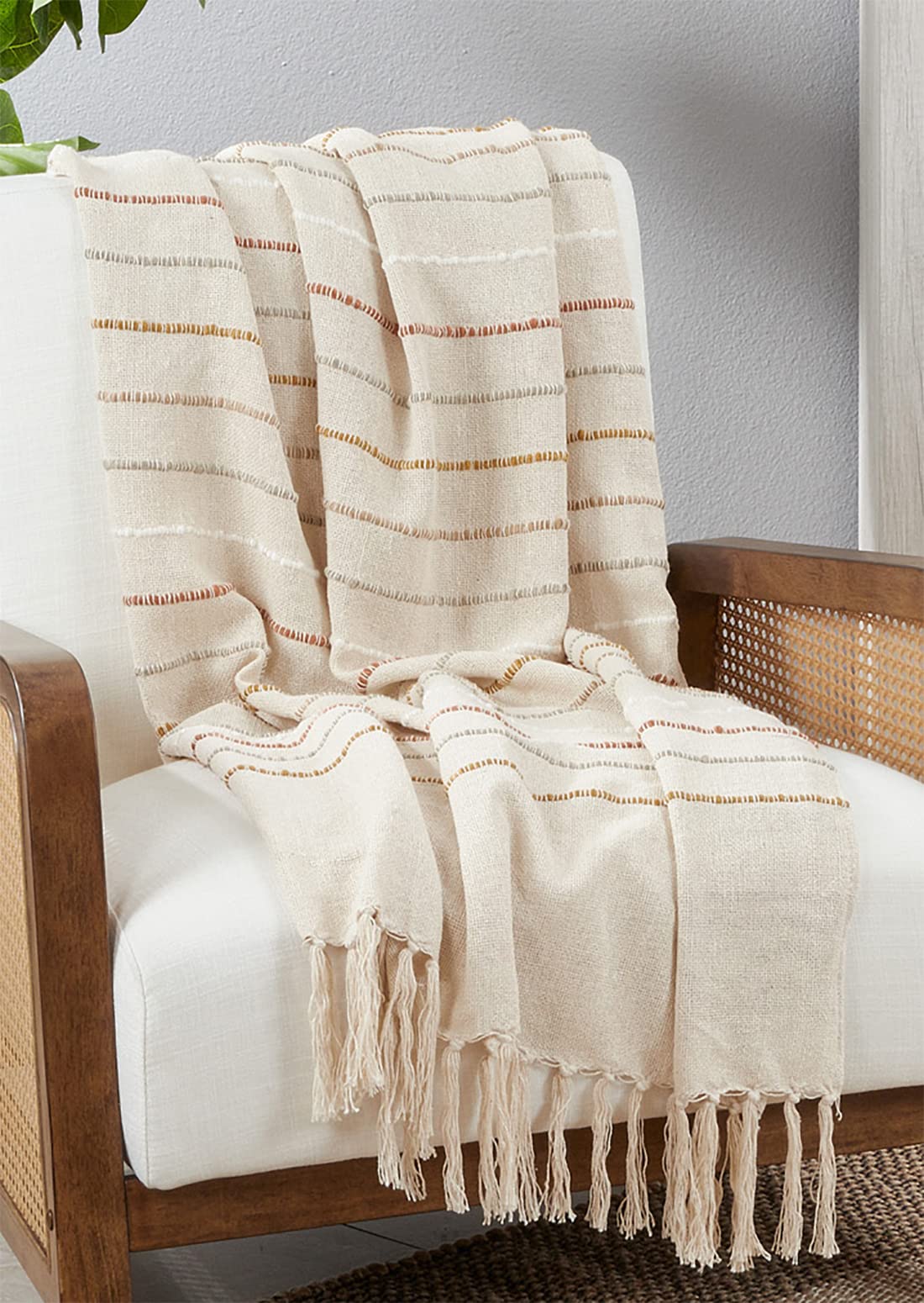 Ivory woven stripe throw blanket with knotted tassels. 50x60